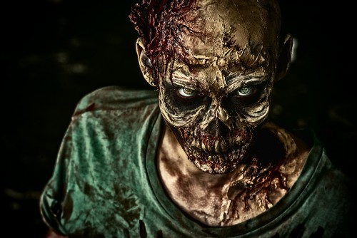 Close-up portrait of a horrible scary zombie man. Horror. Halloween.